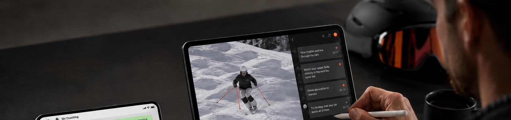 タブレットで滑走動画を確認しながらフィードバックするコーチのイメージ