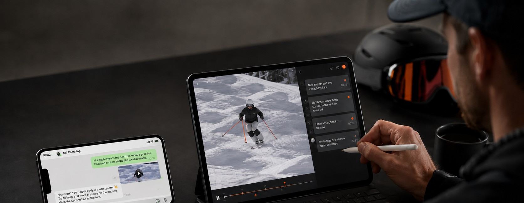 タブレットで滑走動画を確認しながらフィードバックするコーチのイメージ
